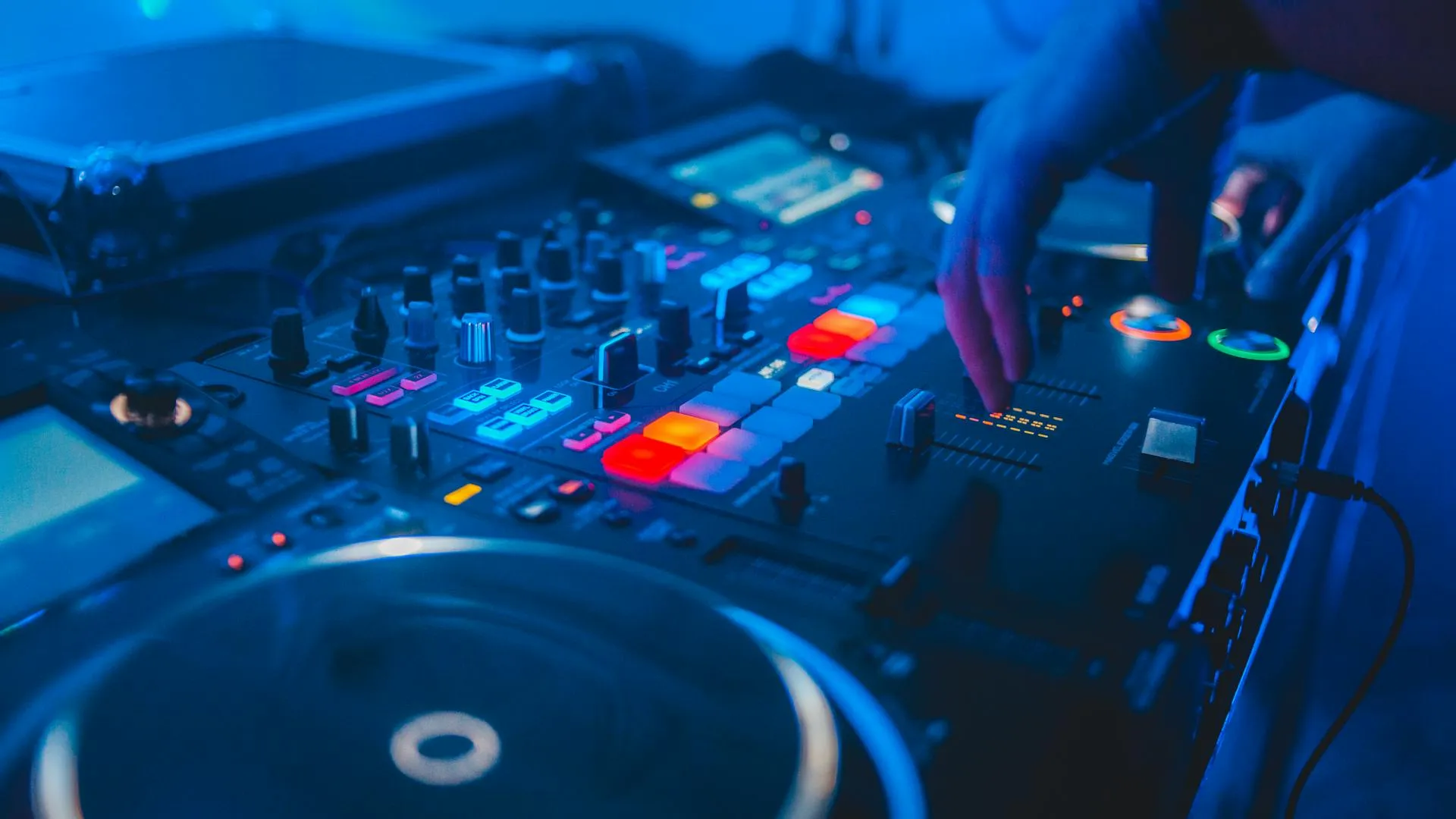 Professional wedding DJ equipment with sound system and colourful lighting